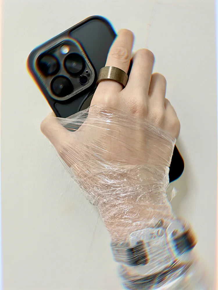 He wore a brass pharaoh ring burned on his fingers, held a cell phone in his hand, and his palms were tightly wrapped in transparent plastic.
