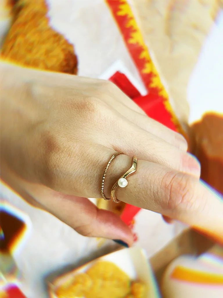 Fairies Whisper delicate gold ring with single pearl detail, minimalist elegant jewelry design